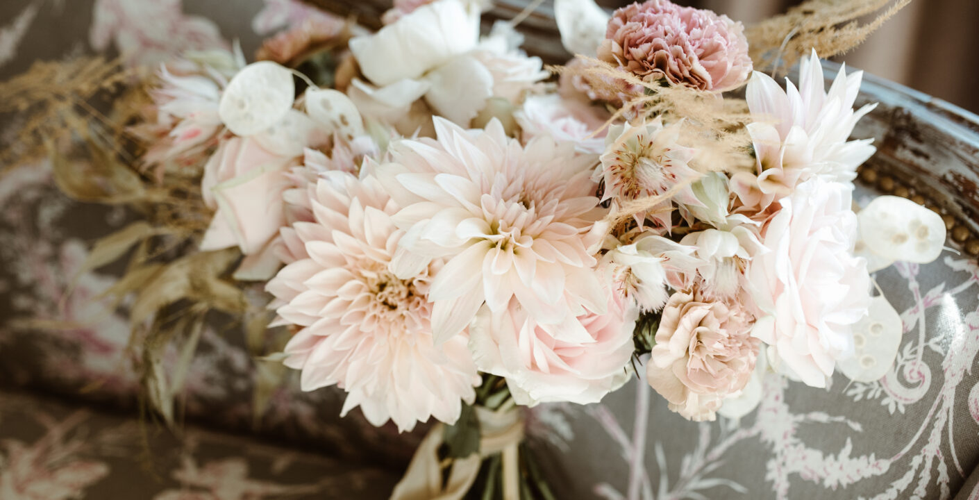 pastel tones flower in a bridal bouquet with dahlias