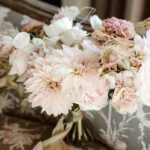 pastel tones flower in a bridal bouquet with dahlias