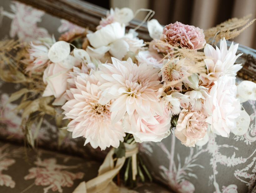 pastel tones flower in a bridal bouquet with dahlias