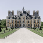 Big chateau, french garden and blue sky for a perfect wedding day.