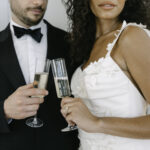 Bride and groom having a toast with champagne in a french chateau