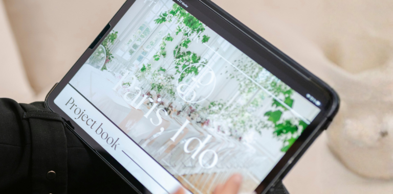 Paris, I do wedding project book presented on a tablet, featuring a customized destination wedding concept and design inspiration